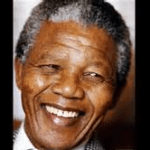 Nelson mandela is smiling in this photo.