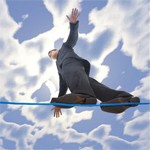 A businessman balancing on a tightrope.